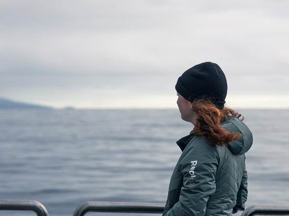 Women looks out onto the view form the Stewart Island Ferry 