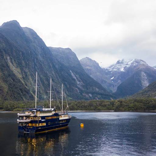 The Milford Mariner vessel cruises through Milford Sound