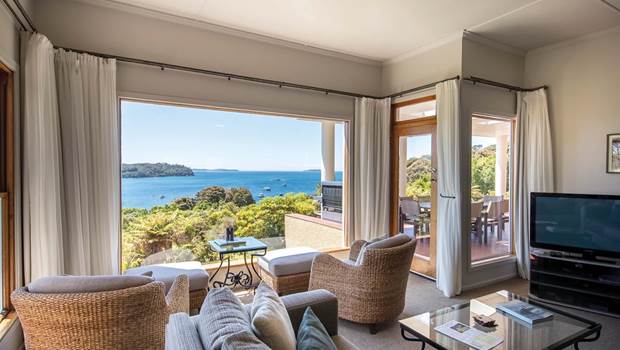 The interiors of a lounge looking out onto the view of Stewart Island