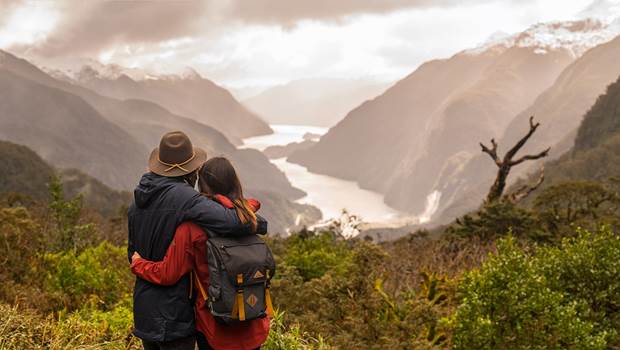 Couple at the Wilmot pass overlooking Doubtful Sound