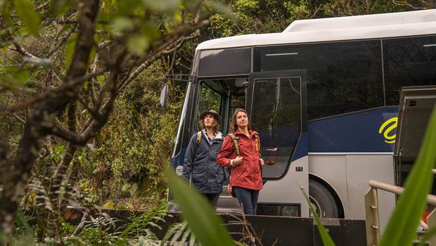 Couple disembark bus to Doubtful Sound