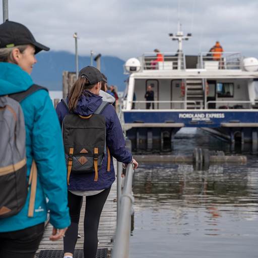 Walkers boarding the Milford Track Ferry at Te Anau Downs